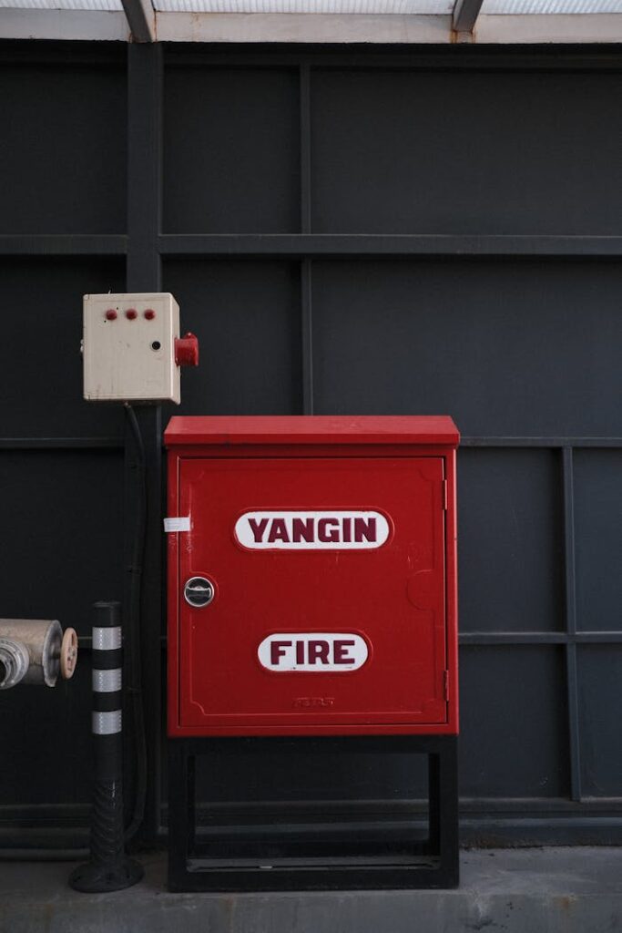 Indoor fire safety cabinet labeled 'Yangın Fire' for emergency use.